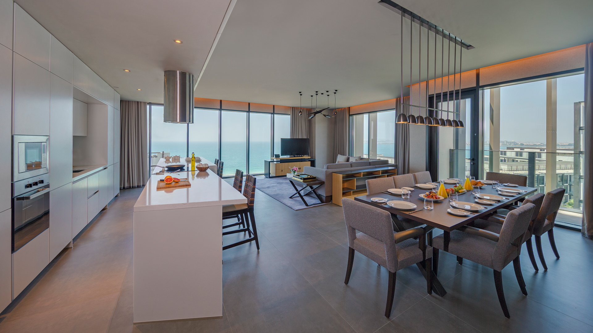 Spacious four-bedroom residence, modern kitchen and dining, ocean view; Banyan Tree Dubai ambiance.